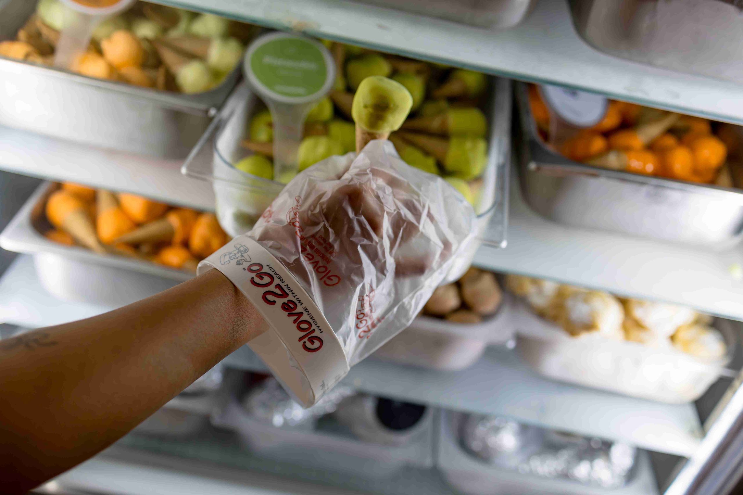 Glove2Go glove used at a refrigerated food preparation counter.